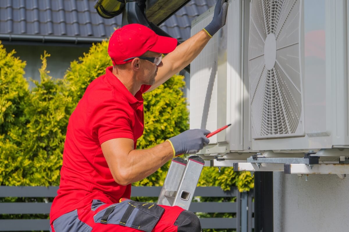 HVAC Worker Performing Heat Pump and Air Condition Units