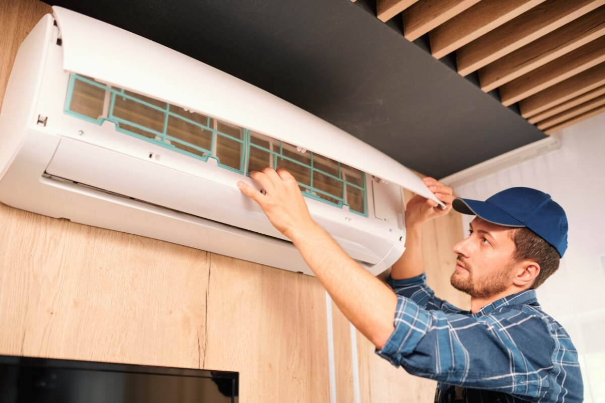 Young Technician Installing Air Conditioning